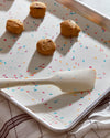Close up view of the 3 Piece Baking set in Sprinkles with small biscuits on the tray.