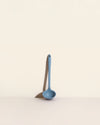 GIR Skinny Ladle in Slate on a cream background.