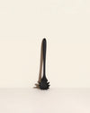 GIR Spaghetti Spoon in Black on a cream background.