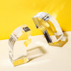 Acrylic Arc Bookends on a yellow and white background.