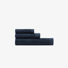 The Onsen Twilight Blue Waffle Bath Towel set on a white background.