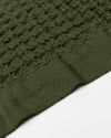 Close up of the Onsen Forest Waffle Bath Sheet on a white background.