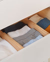 The Open Spaces Drawer Divider inside a drawer separating cloths.