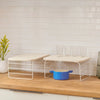The Open Spaces Shelf Risers on a kitchen counter top.