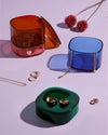 The Multi - Color Storage gems with jewellery stored in it on a white background.