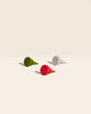 GIR Bottle Stoppers in Holiday on a cream background.