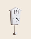Modern Cuckoo Clock in White on a cream background.