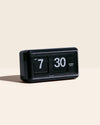 Mid Century Flip Clock in Black on a cream background.