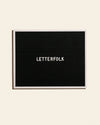 Copywriter in Black on a cream background.
