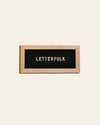 Letterfolk Mini Oak Letter Board on a cream background.