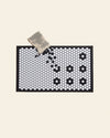 Letterfolk Tile Mat in White on a cream background.