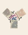 Letterfolk Tile Set in Floral on a cream background.