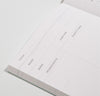 Close up of the page of Poketo Food Planner on a white background.