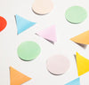 Geometric Sticky Notes on a pink background.