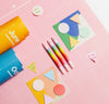 Geometric Sticky Notes amongst other Poketo products on a pink background.