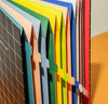 A close up of an open Accordion Pro Filer in Large on an orange surface.