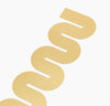 Close up of the Brass Bookmark in Wave on a white background.