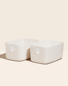 Two Open Spaces Large Cream Storage Bins with no lids on a cream background.