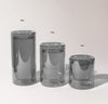 A 16 oz , 12 ox and 6 oz Gray Double Wall Glass on a cream background.