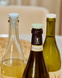 GIR Bottle Stoppers in Everyday Neutrals on wine bottles