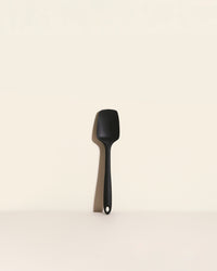GIR Spoonula in Black on a cream background.