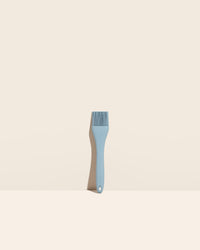 The GIR Slate Ultimate Basting Brush on a cream background. 