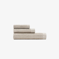 The Onsen Oatmeal Waffle Bath Towel set on a white background. 
