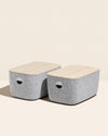 2 Open Spaces Large Felt Storage bins with wooden lids on a cream background.