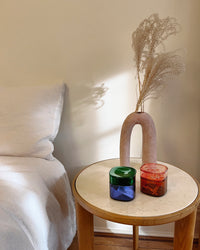 The Multi - Color Storage gems on a bedside table. 