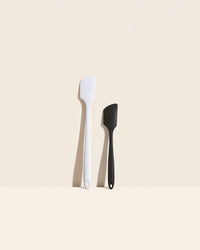 GIR Skinny and Mini Spatula Set in Cookies and Cream on a cream background.