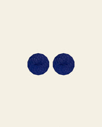 GIR Suction Lid in Navy on a cream background.