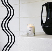 A 8 Oz Hinoki candle on a white background. 